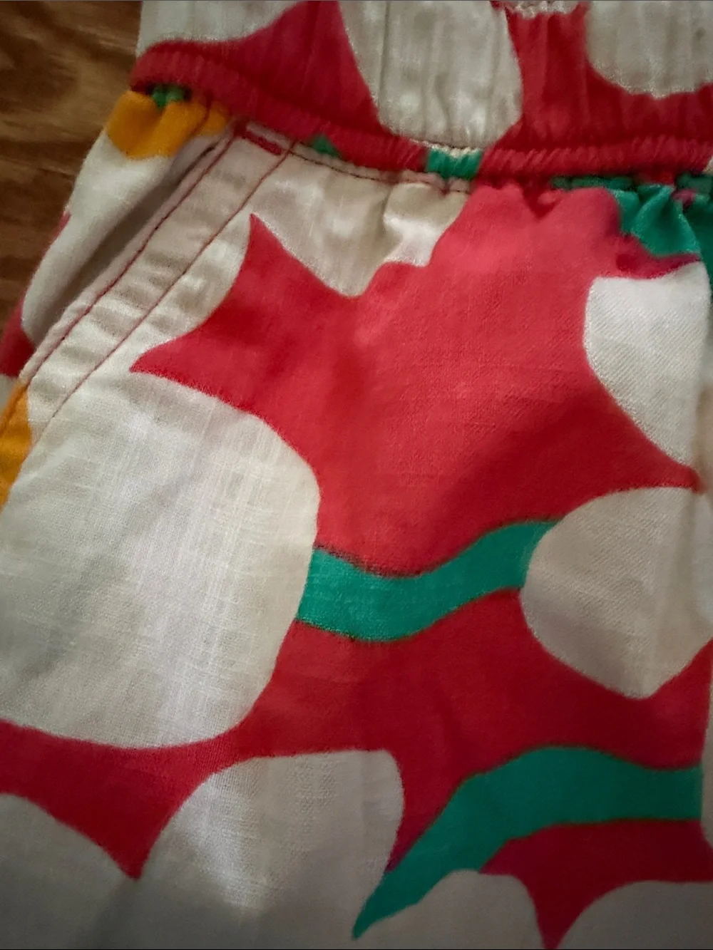 Hanna Andersson White Floral swim shorts with Red, Yellow & Teal Accents